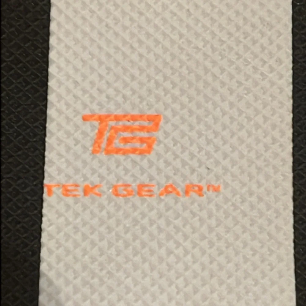 Tek Gear black and white flip flops. New with tag. Women’s size L (9-10)